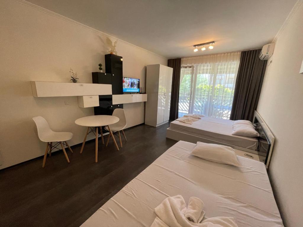 Postel nebo postele na pokoji v ubytování MM Complex Dimitrovi