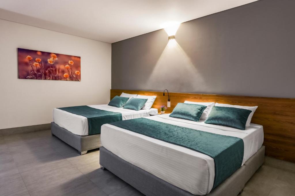 Katil atau katil-katil dalam bilik di HOTEL RILUX Barrancabermeja