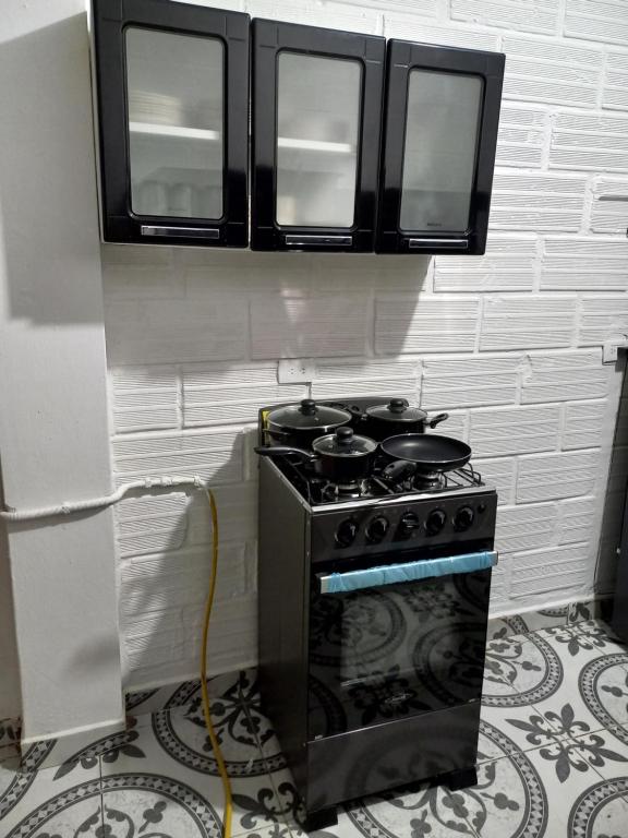 Kuchyň nebo kuchyňský kout v ubytování Apartamento Santorini Colombiano