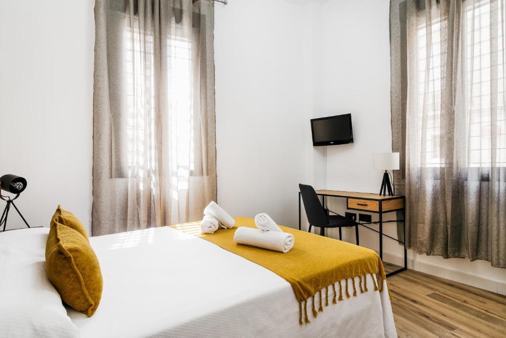 Postel nebo postele na pokoji v ubytování Apartamento Macarena junto a la Basílica de la Macarena