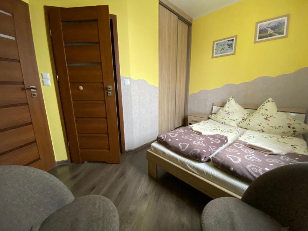Posteľ alebo postele v izbe v ubytovaní DARIA pokoje gościnne