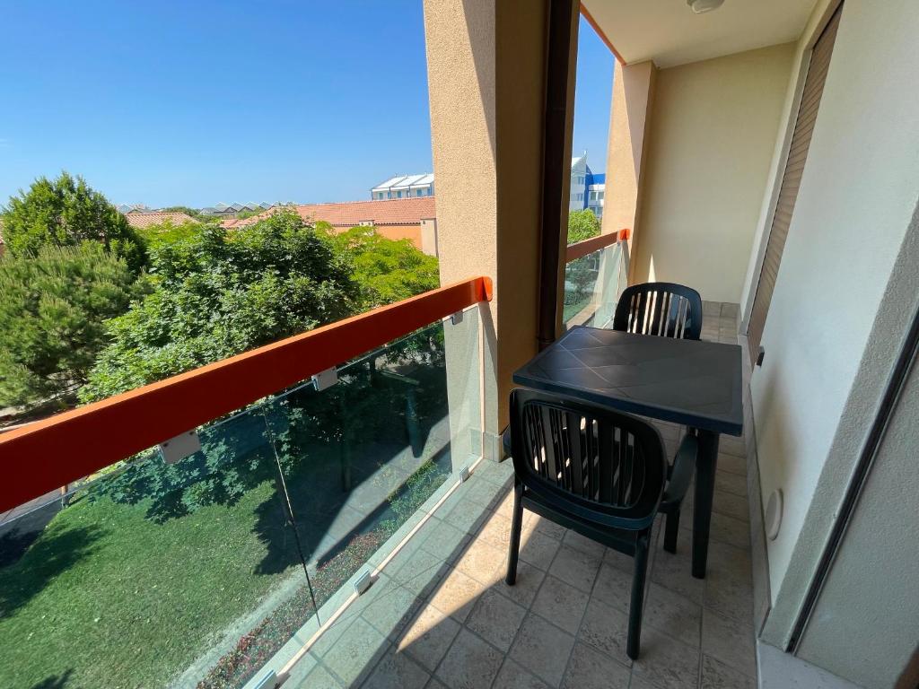 A balcony or terrace at Villaggio ai Ginepri - Agenzia Cocal