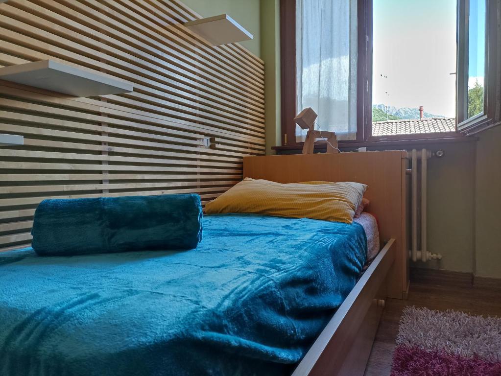 Postel nebo postele na pokoji v ubytování Barzio Paradise