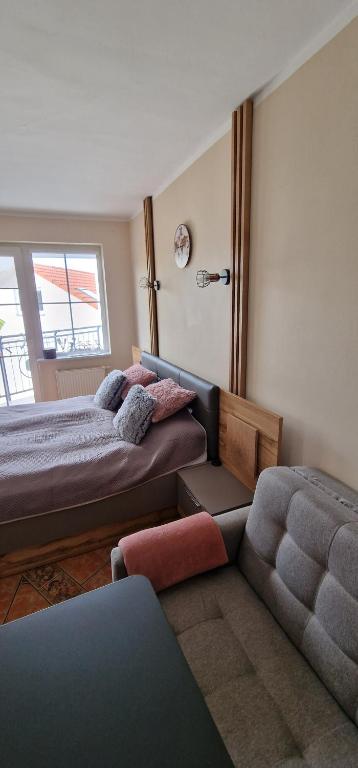 Posteľ alebo postele v izbe v ubytovaní Apartamenty Hexagon nr 15