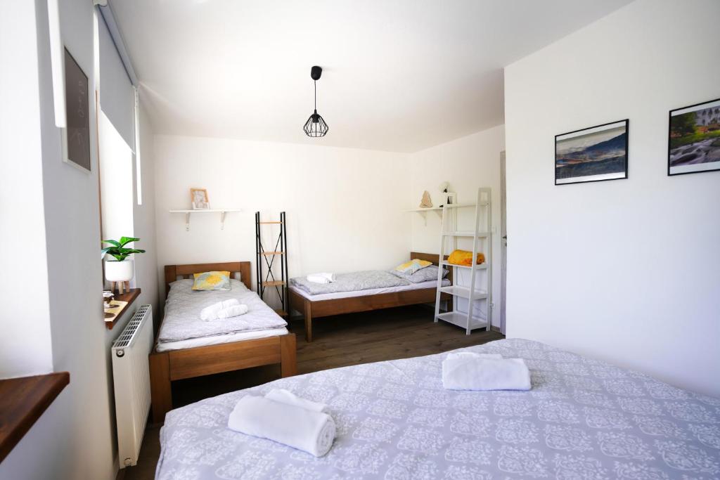 Postel nebo postele na pokoji v ubytování APARTMÁNY DRING