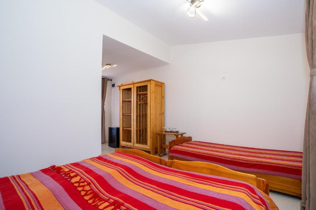 Postel nebo postele na pokoji v ubytování Casa Nikita
