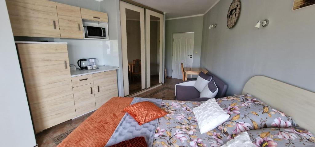 Posteľ alebo postele v izbe v ubytovaní Apartamenty Hexagon nr 25