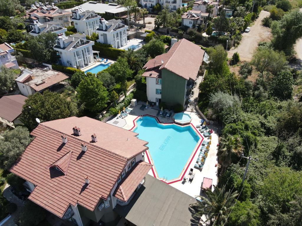 an aerial view of a house with a swimming pool at Balkaya Hotel in Oludeniz