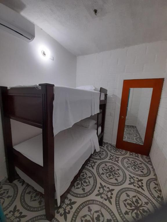 Postel nebo postele na pokoji v ubytování Apartamento Santorini Colombiano