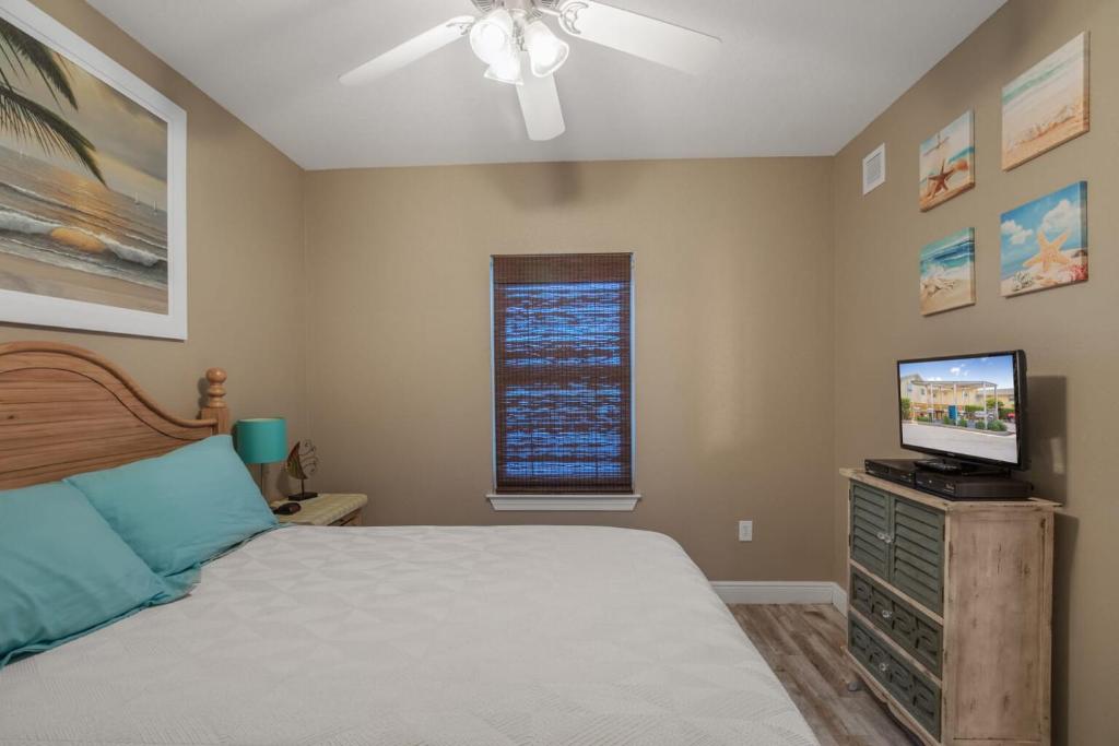 a bedroom with a bed and a television on a dresser at Crystal Tower 1906 by Vacation Homes Collection in Gulf Shores