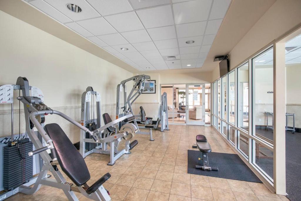 a gym with cardio equipment in a building at Crystal Tower 1906 by Vacation Homes Collection in Gulf Shores