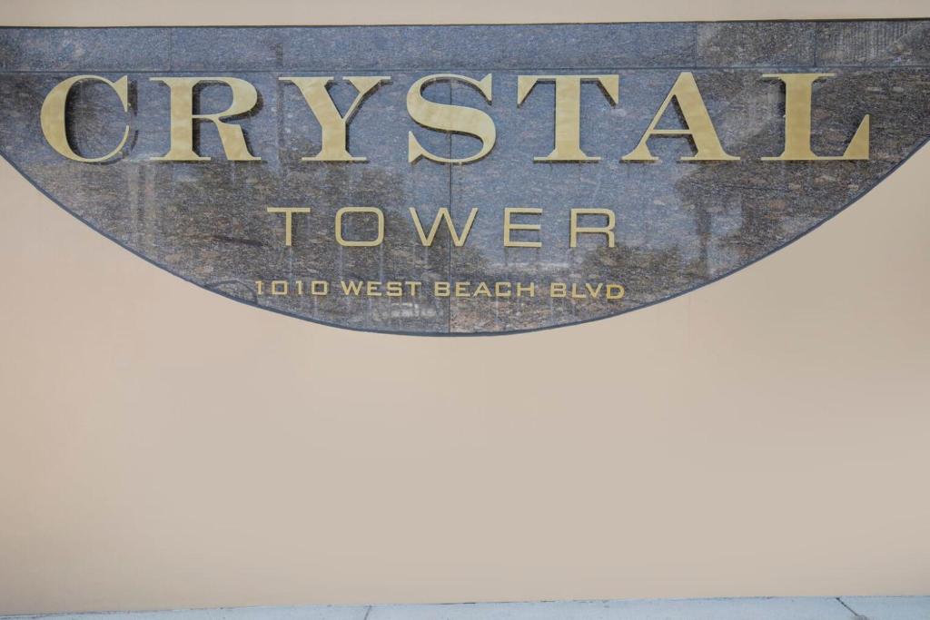 a sign for the city of cyrstal tower at Crystal Tower 1906 by Vacation Homes Collection in Gulf Shores