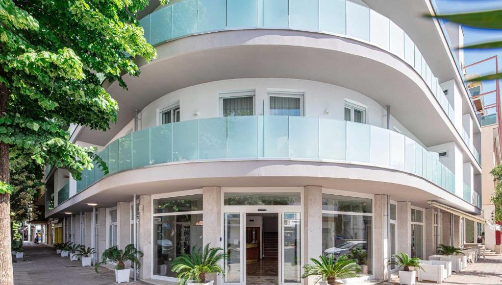 a round building with a glass dome on it at Hotel Centrale in Lignano Sabbiadoro