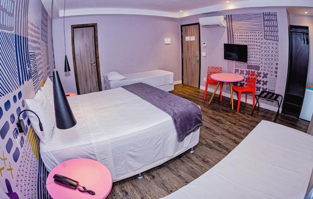 Postel nebo postele na pokoji v ubytování B Hotel Salvador