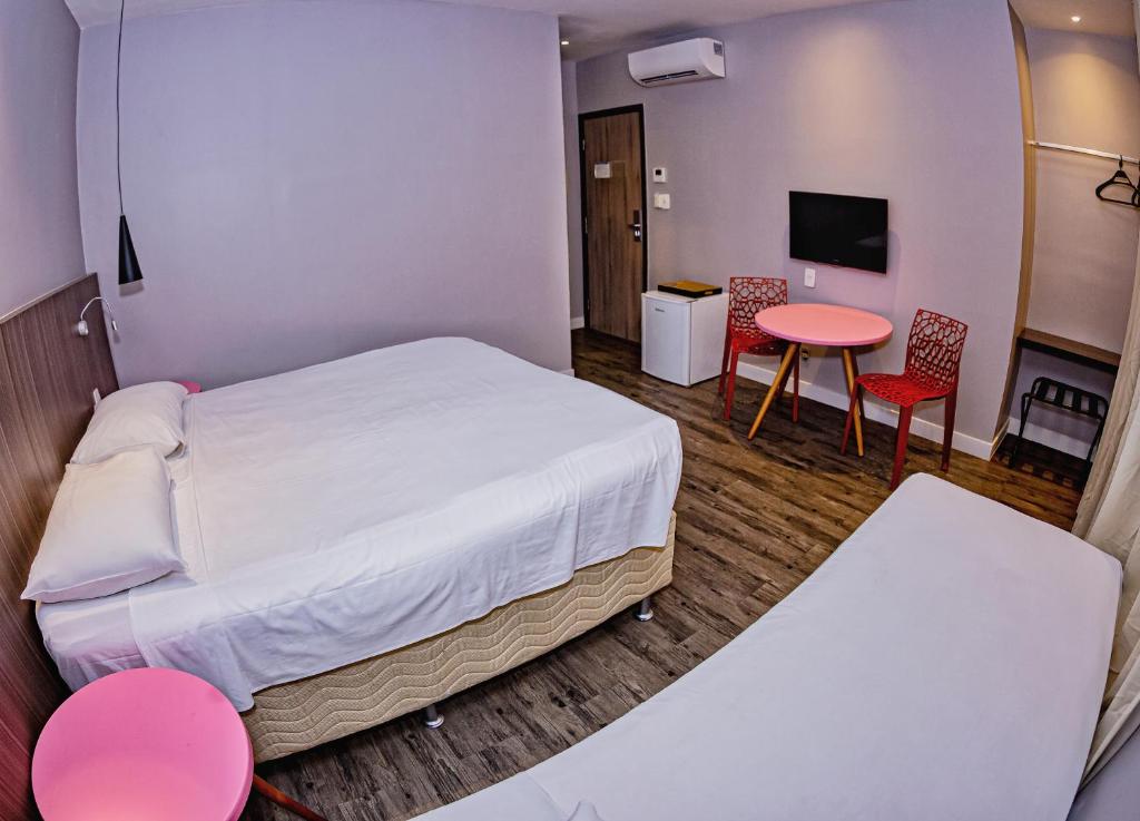 Postel nebo postele na pokoji v ubytování B Hotel Salvador