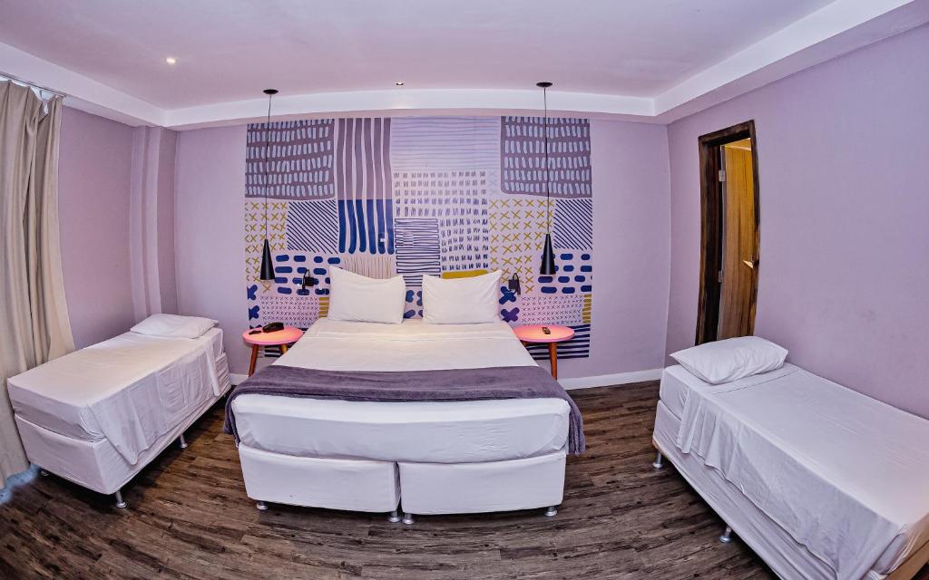 Postel nebo postele na pokoji v ubytování B Hotel Salvador