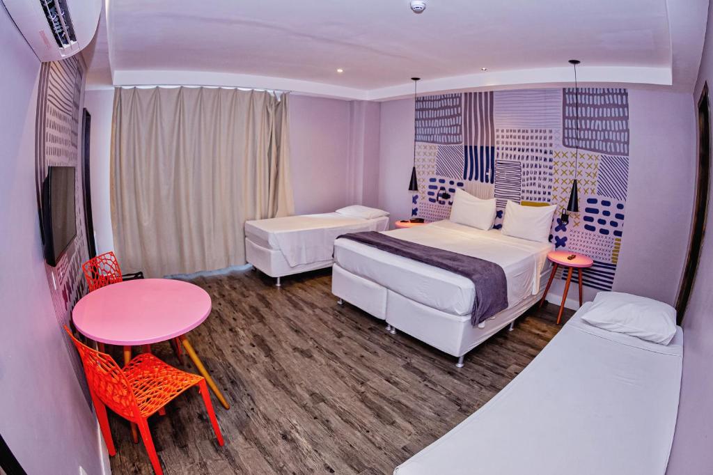 Postel nebo postele na pokoji v ubytování B Hotel Salvador