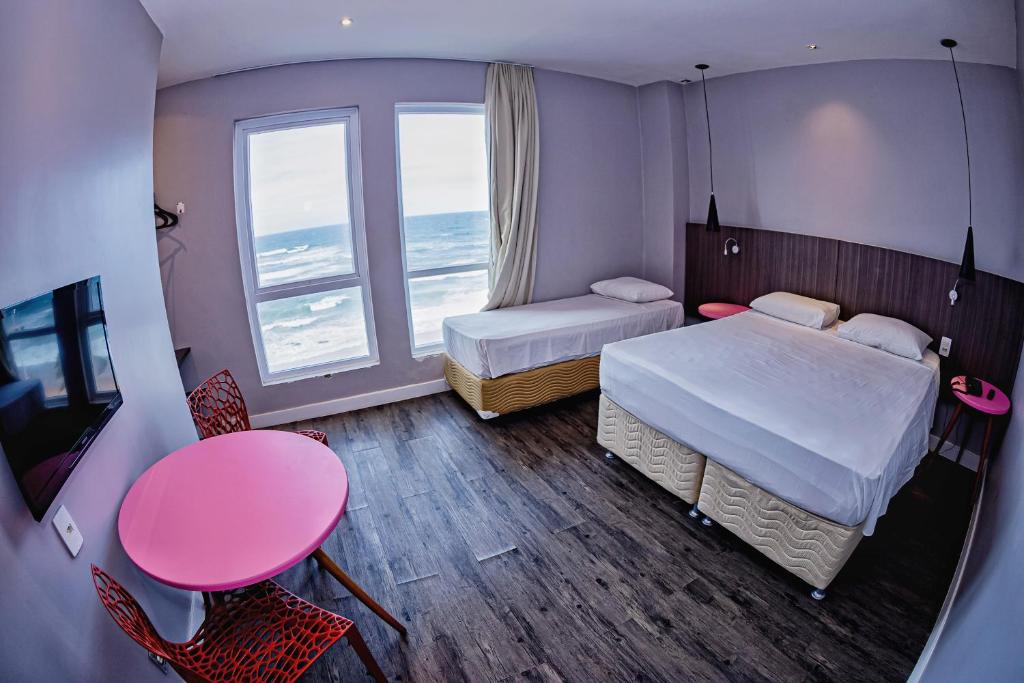 Postel nebo postele na pokoji v ubytování B Hotel Salvador