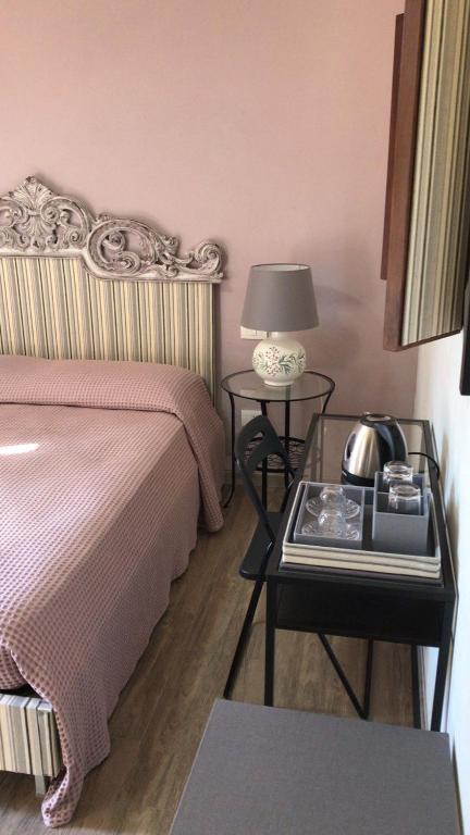 Postel nebo postele na pokoji v ubytování Residenza San Matteo