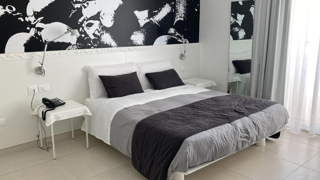 Postel nebo postele na pokoji v ubytování QuiHotel