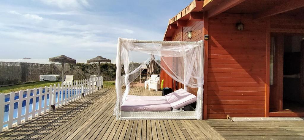 a porch with a hammock on a house at Conil, 5min centro, playas in Conil de la Frontera