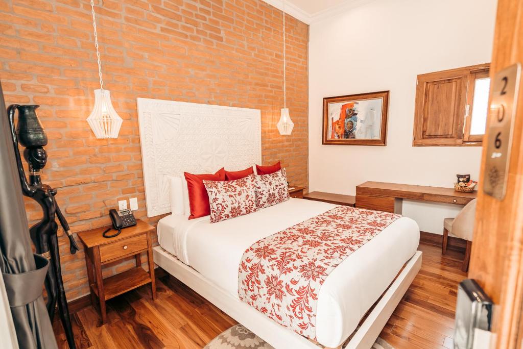 Postel nebo postele na pokoji v ubytování Hotel Otavalo