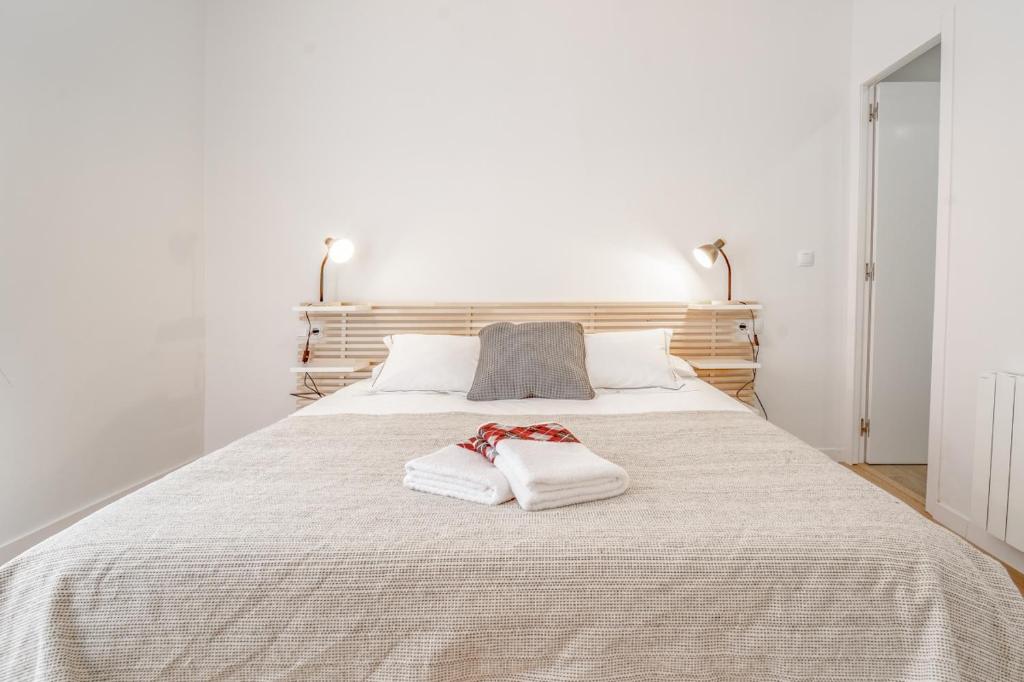 A bed or beds in a room at 3.1 Apartamento Cap del Bosc