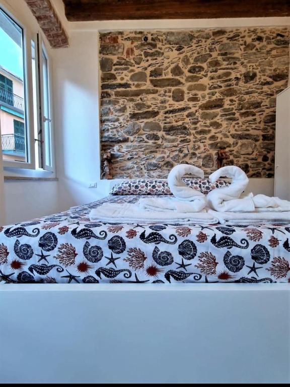 Postel nebo postele na pokoji v ubytování L' Onda di Manarola