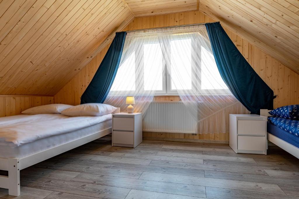 Postel nebo postele na pokoji v ubytování Przystanek Mewa