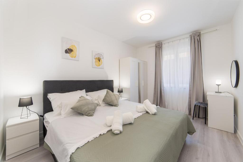 Posteľ alebo postele v izbe v ubytovaní Apartman Porto
