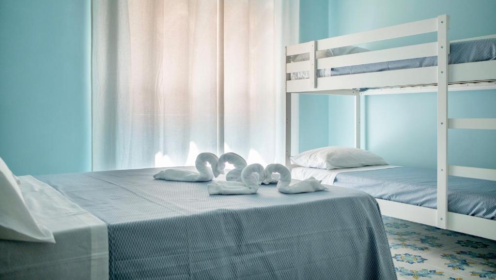 Posteľ alebo postele v izbe v ubytovaní B&B Margherita 2