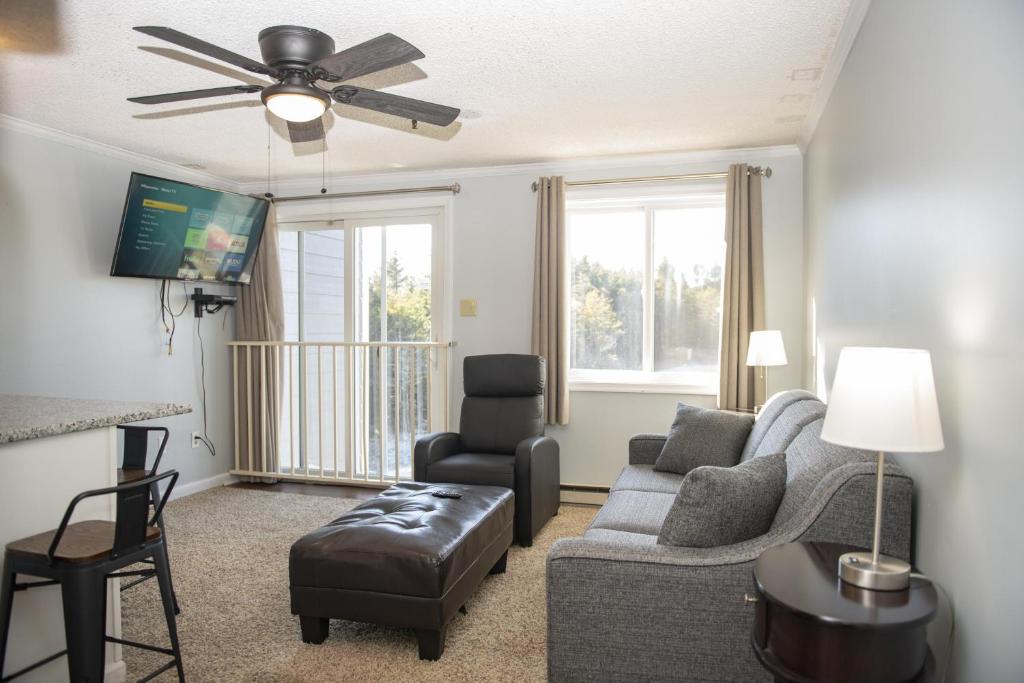 a living room with a couch and a ceiling fan at Stroll to Slopes, Village Area, Ski in-out MtLodge 269 in Snowshoe