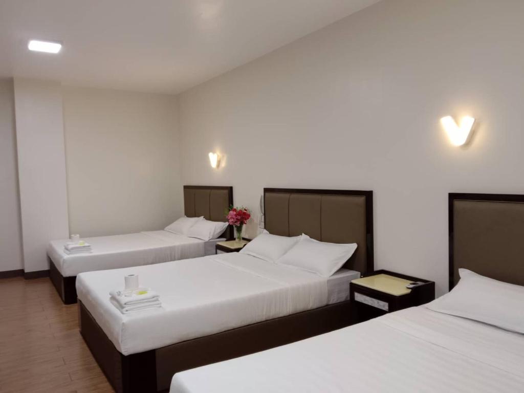 Postel nebo postele na pokoji v ubytování Meaco Royal Hotel- Lucena