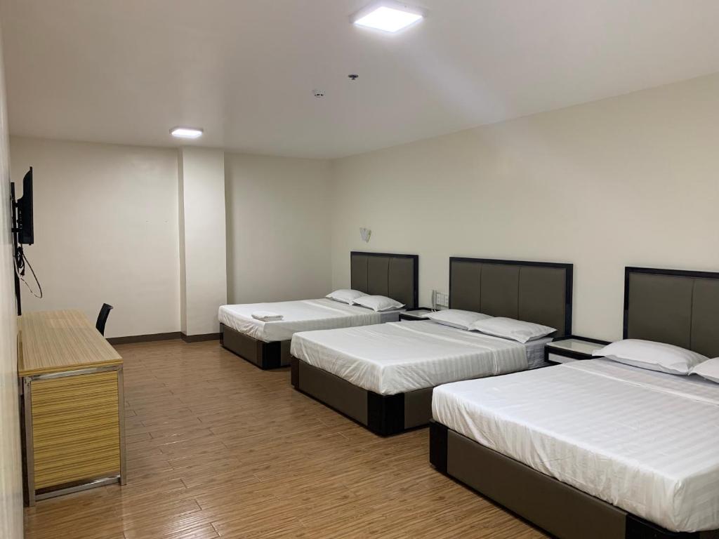 Postel nebo postele na pokoji v ubytování Meaco Royal Hotel- Lucena