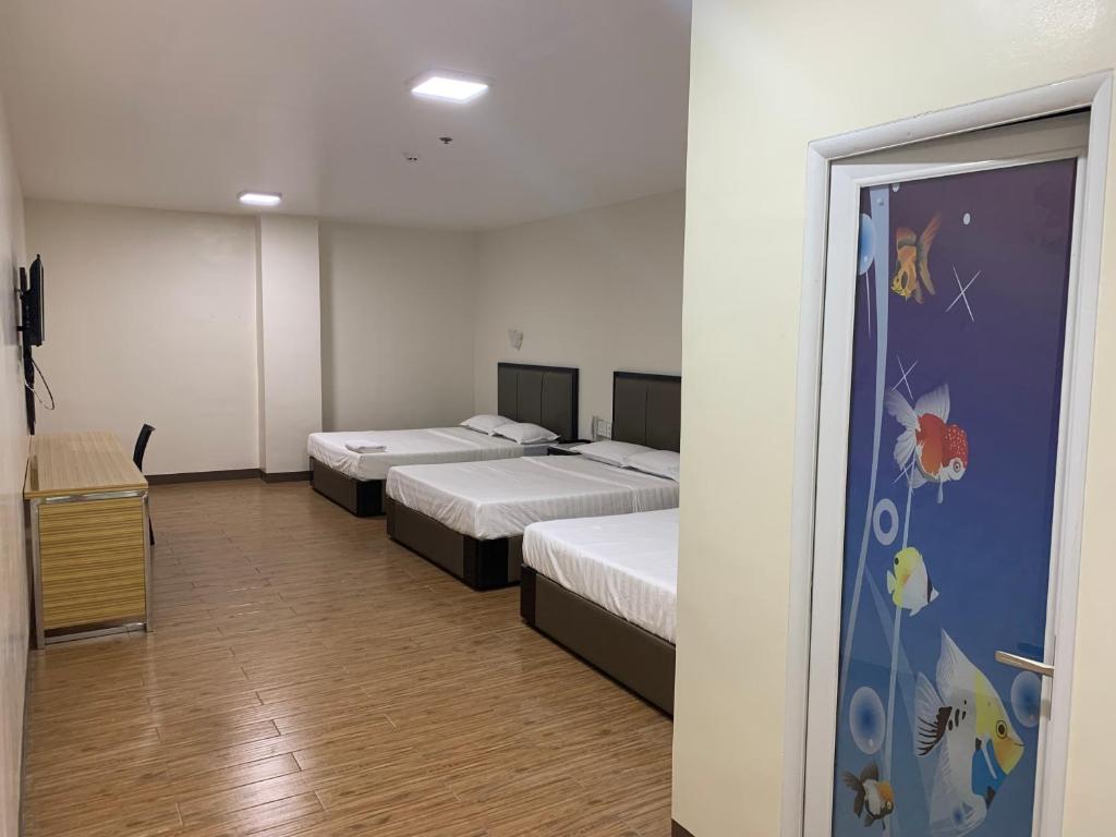 Postel nebo postele na pokoji v ubytování Meaco Royal Hotel- Lucena
