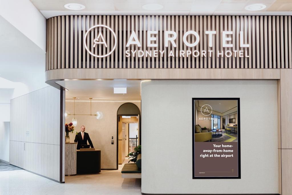 a hotel entrance with a sign that reads aire hotel at Aerotel Sydney (Arrivals B, International Terminal 1) in Sydney