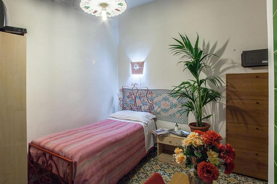 Krevet ili kreveti u jedinici u objektu Hotel Villarosa con Vespa Rent