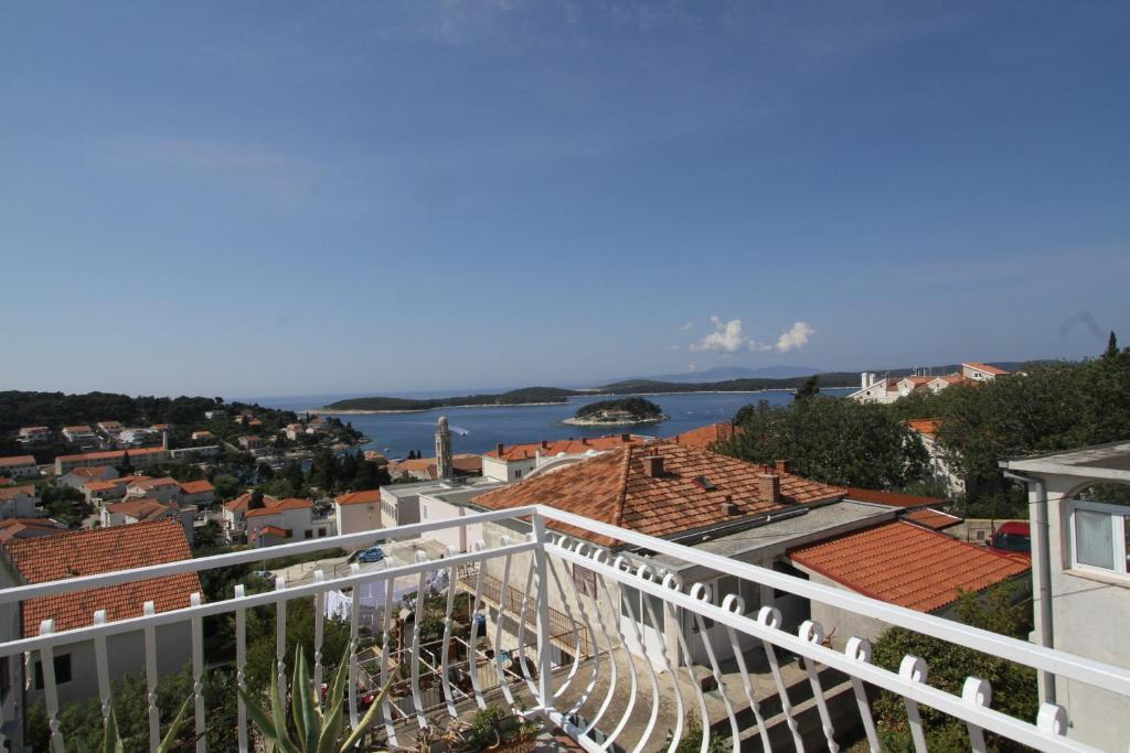 a view of the water from the balcony of a house at Tanya-Apartments and Rooms in Hvar