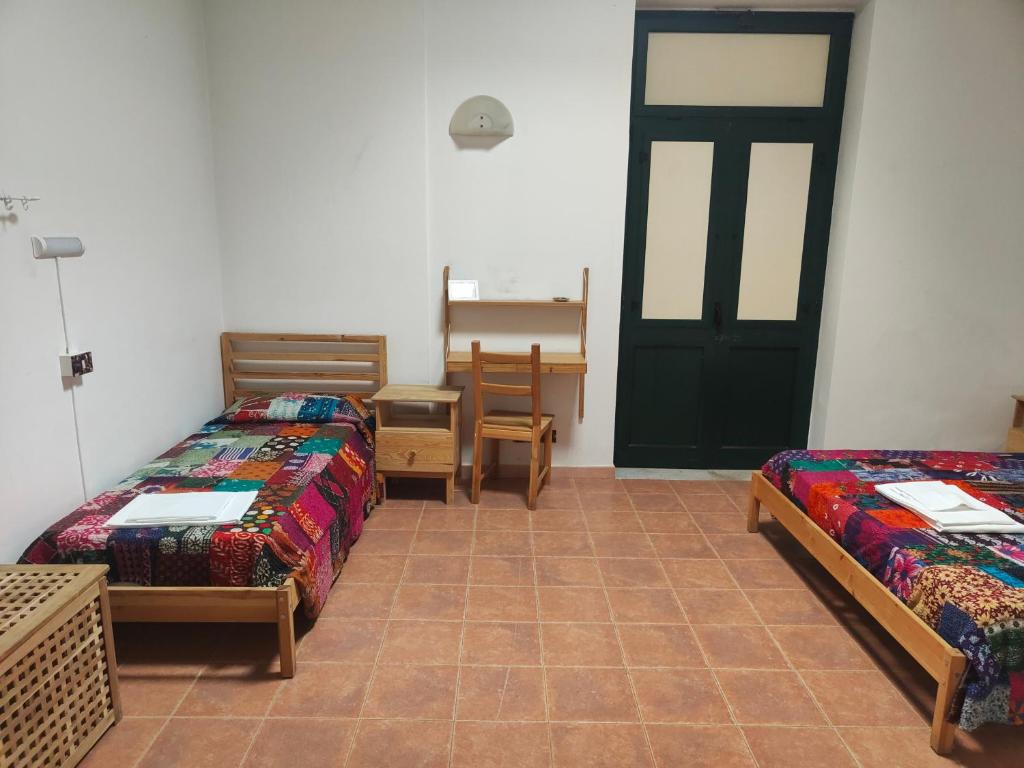 Posteľ alebo postele v izbe v ubytovaní Beteyà Hostel Don Bosco