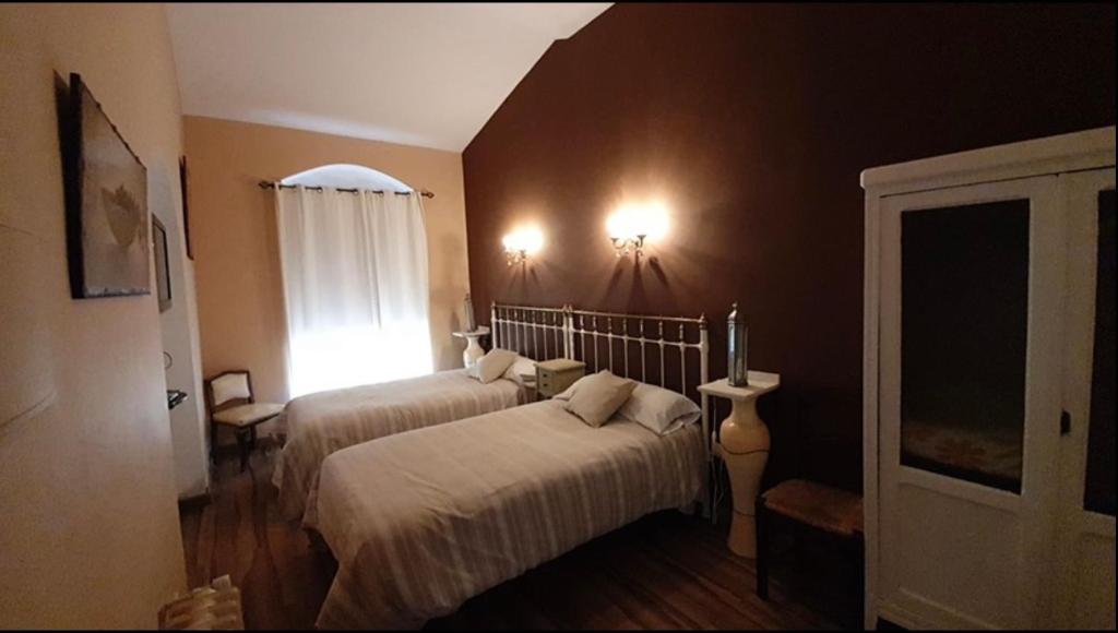Postel nebo postele na pokoji v ubytování Hotel Rural las Cinco Ranas