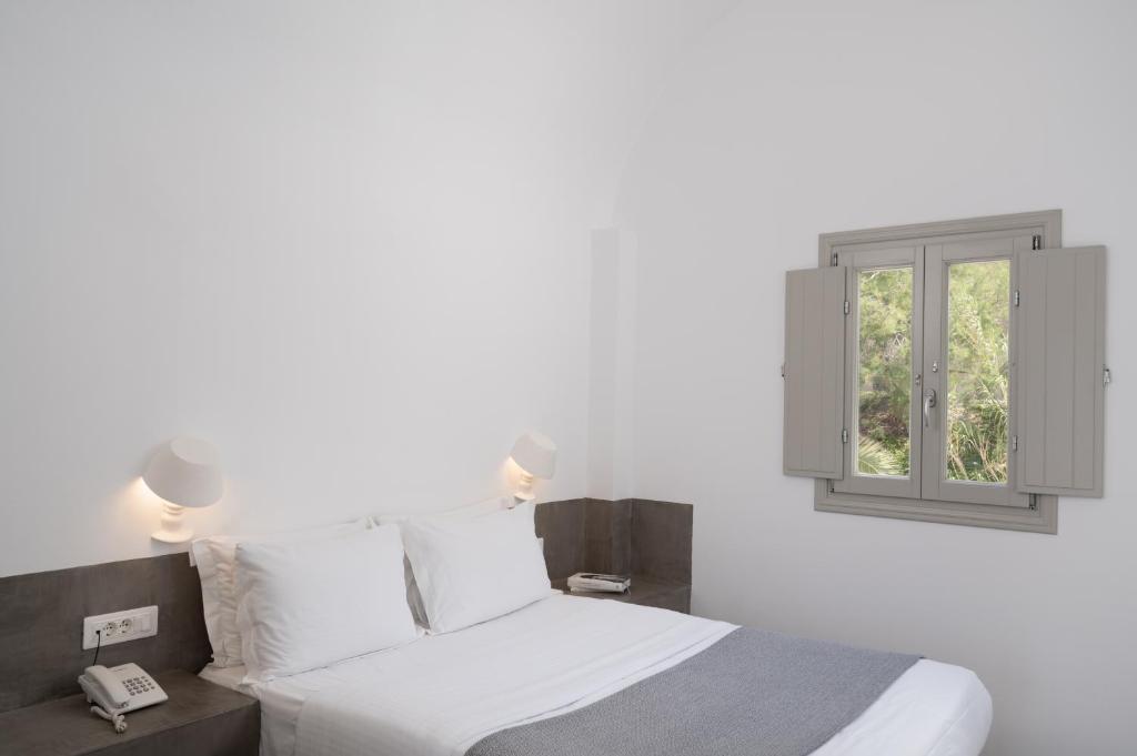 Letto o letti in una camera di Hotel Goulielmos