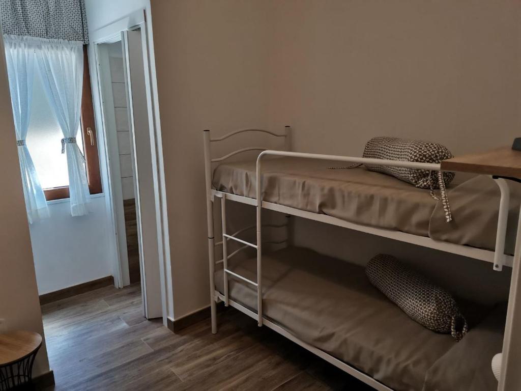 Postel nebo postele na pokoji v ubytování Al Centesimo Chilometro - Ristoro del Pellegrino