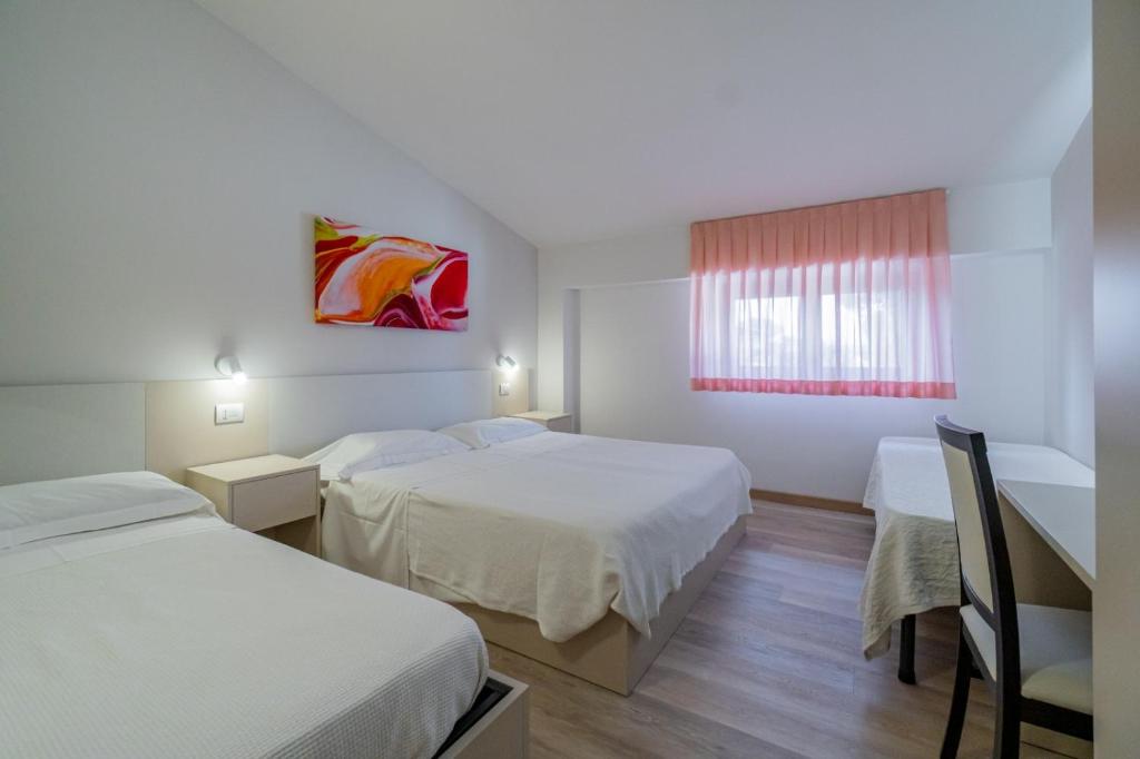 Postel nebo postele na pokoji v ubytování Hotel Bellavista