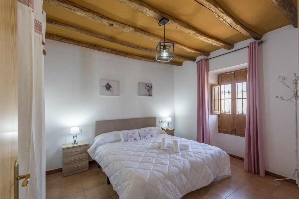 Postel nebo postele na pokoji v ubytování Casa Rural Maimones