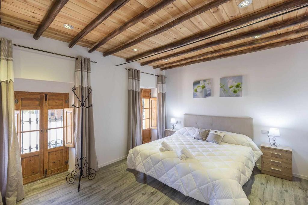 Postel nebo postele na pokoji v ubytování Casa Rural Maimones
