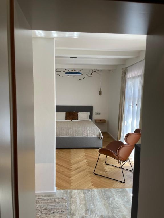 Postel nebo postele na pokoji v ubytování HARDY - Cognac & Pension