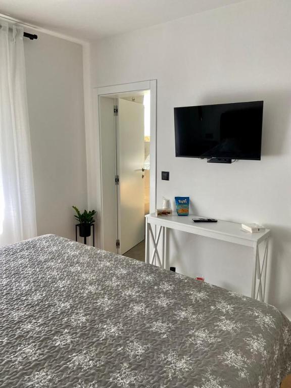 TV a/nebo společenská místnost v ubytování Portum rooms