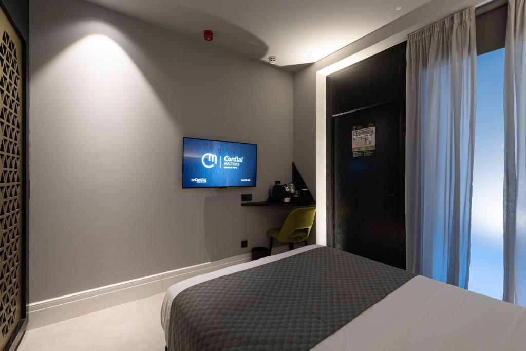 Boutique Hotel Cordial Maltesesにあるテレビまたはエンターテインメントセンター