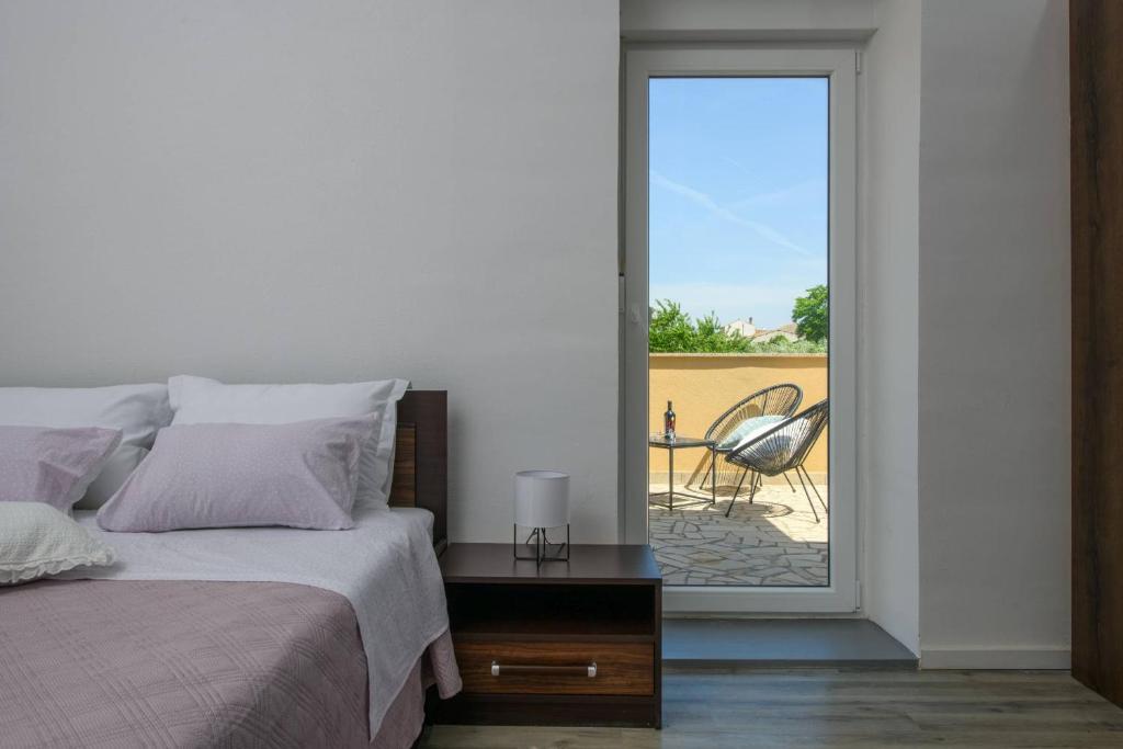 Postel nebo postele na pokoji v ubytování Holiday house Boky