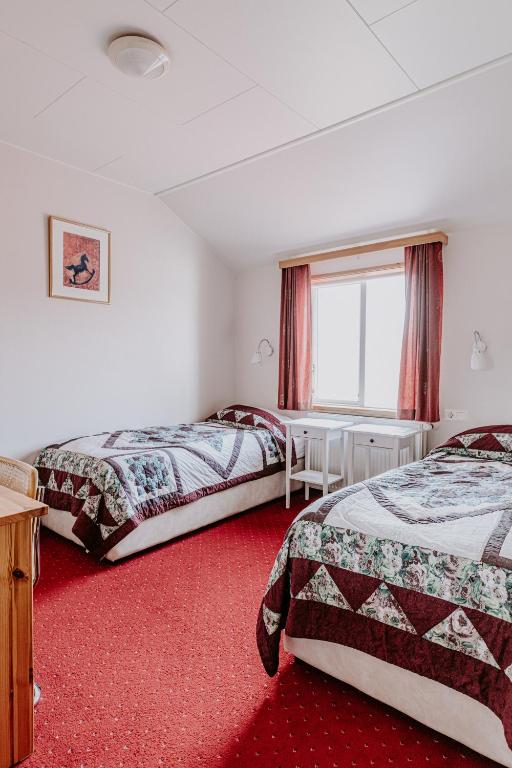 Postel nebo postele na pokoji v ubytování Narfastadir Guesthouse